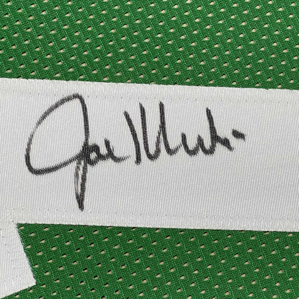 Autographed white fabric tag on green mesh jersey in professionally framed Joe Klecko signed jersey with Beckett BAS