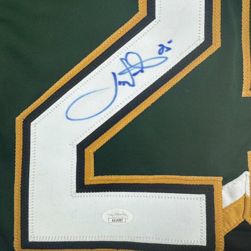 Green and gold Dallas Stars jersey with blue autograph and authentication sticker