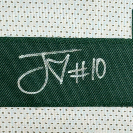 Dark green woven label with white embroidered script jn#10 on a framed autographed jordan love green bay jersey