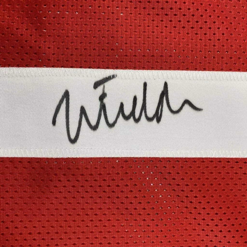 Framed autographed ohio state red mesh football jersey with white stripe and black signature by justin fields