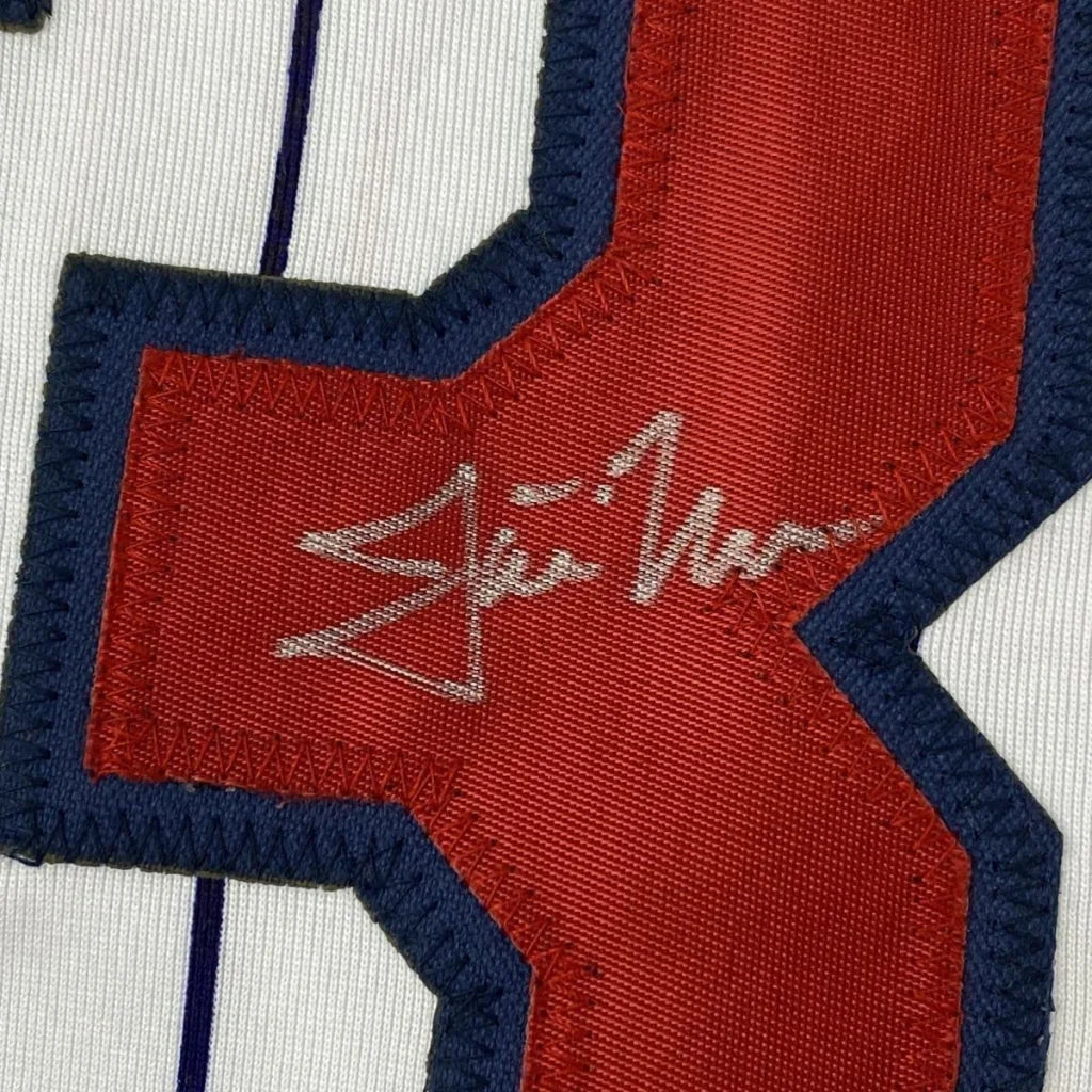 Red and blue fabric patch with silver signature on Justin Morneau Signed Jersey Display