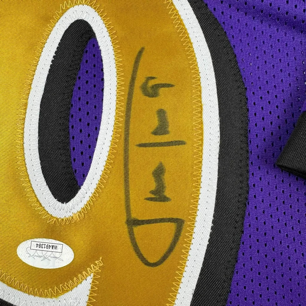 Autographed purple and gold Ravens jersey in a framed display for Justin Tucker fans
