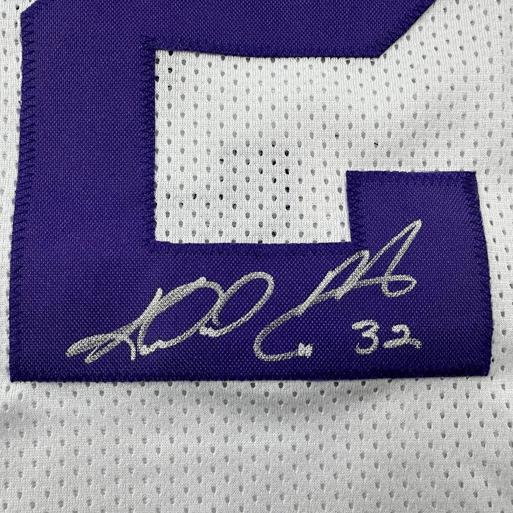 White Karl Malone Utah Jazz jersey with purple number 2 and silver autograph for display