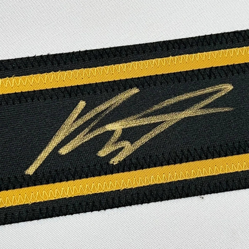 Black fabric band with yellow stripes and gold signature from Game Worn Autographed Hockey Jersey