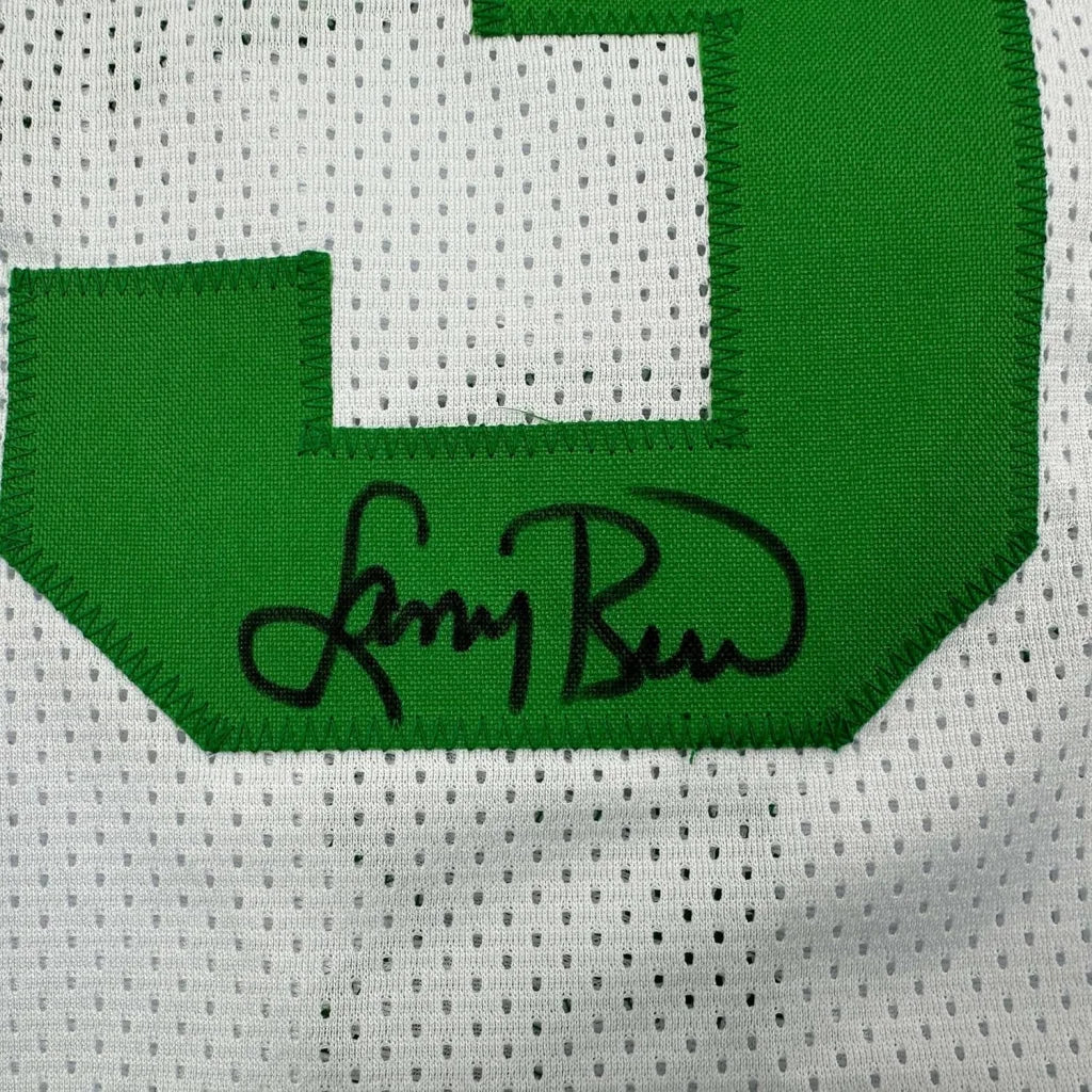 White mesh Larry Bird jersey with green 3 and black autograph in a professionally framed display