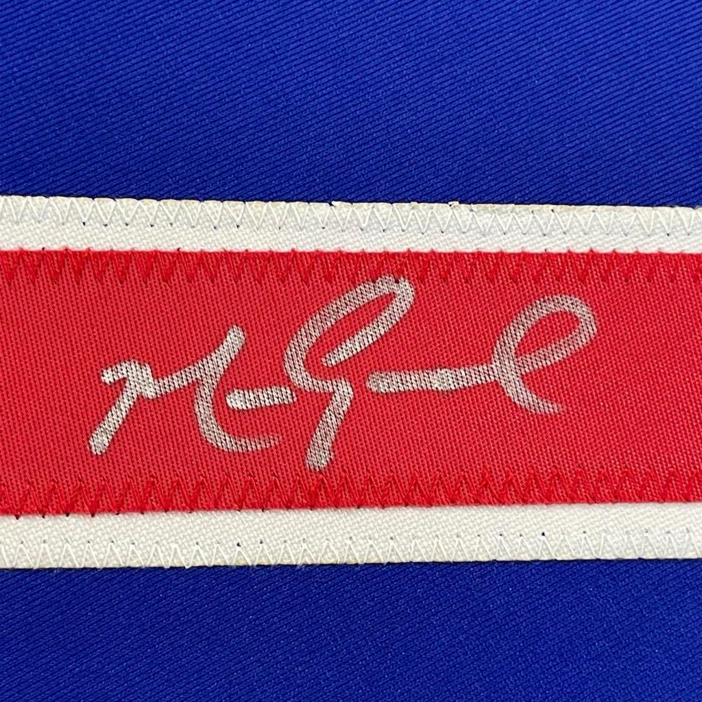 Framed autographed Mark Grace Chicago Blue jersey with red woven label