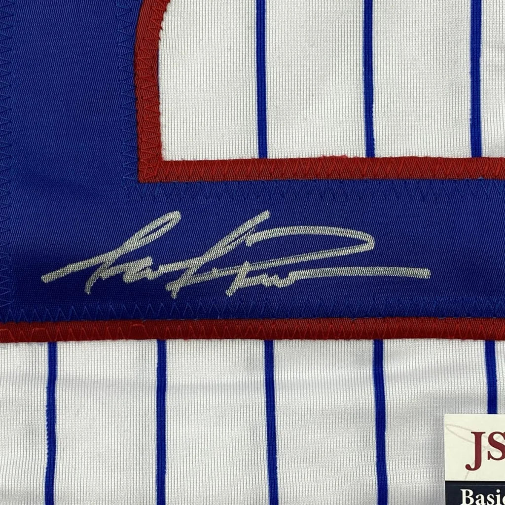 Autographed pinstriped Cubs jersey with red and blue trim for Man Cave decor