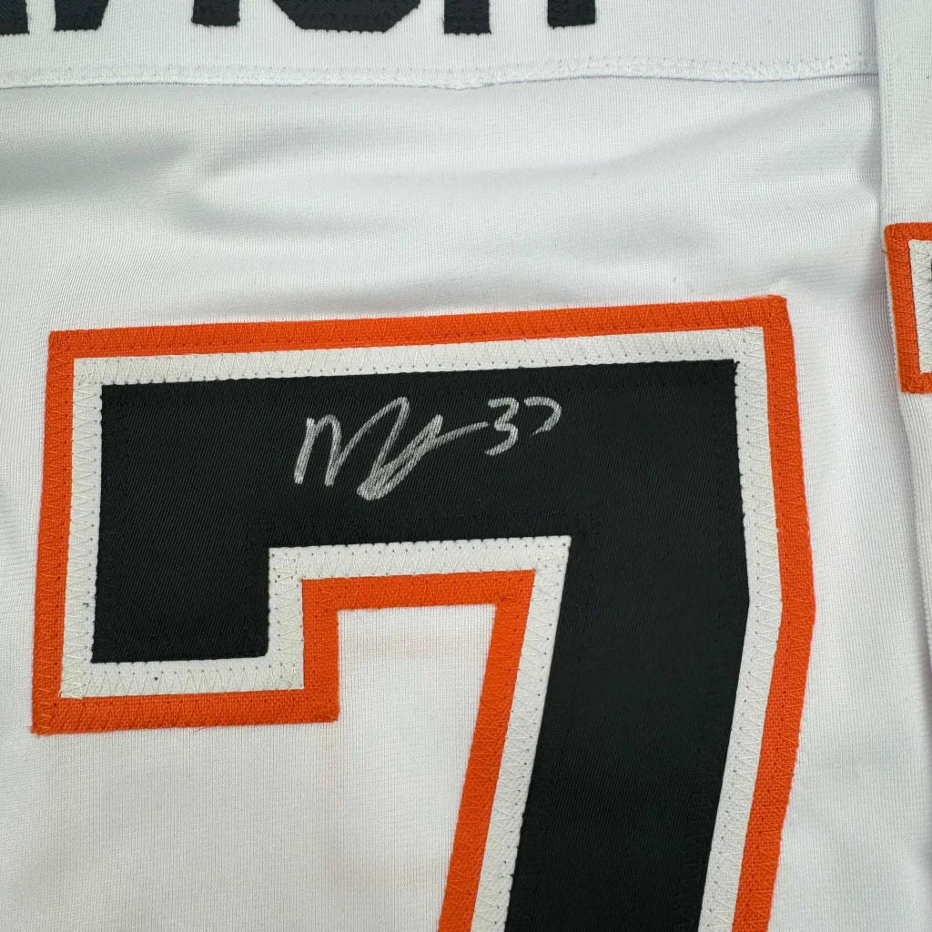 White McTavish signed hockey jersey with black and orange number 7 and autograph