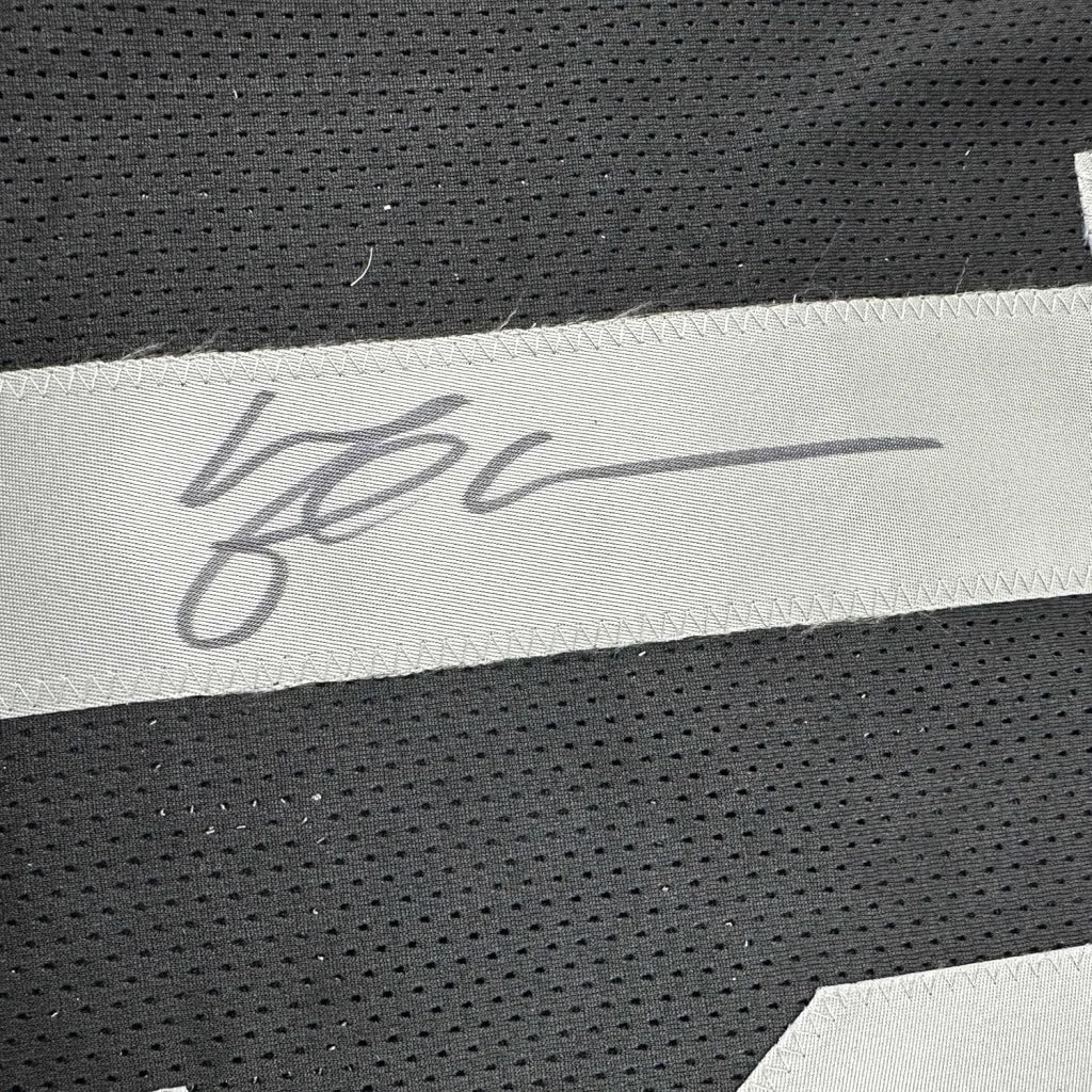 Framed autographed Michael Crabtree Oakland Raiders black jersey with gray signature