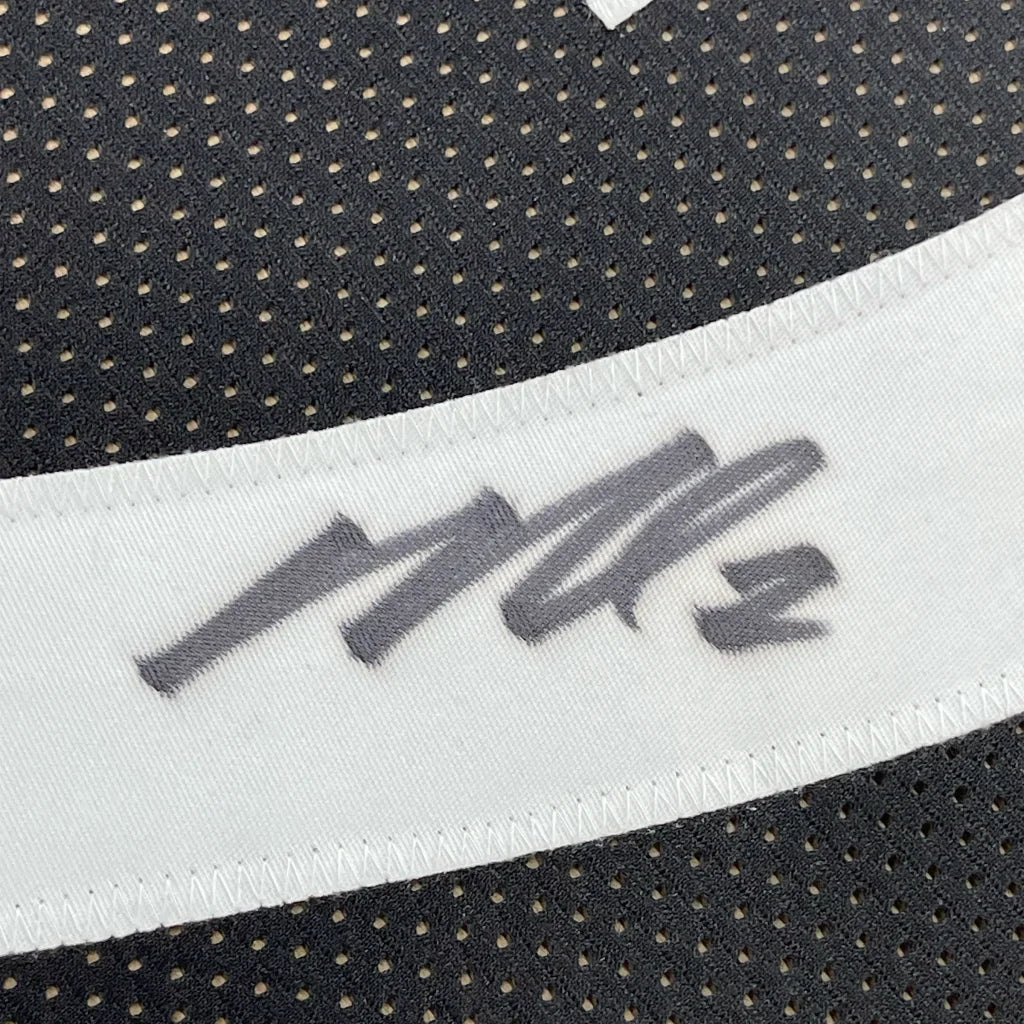 Black mesh fabric with white elastic band and gray MZ logo on Epic Michael Vick Steelers Jersey display