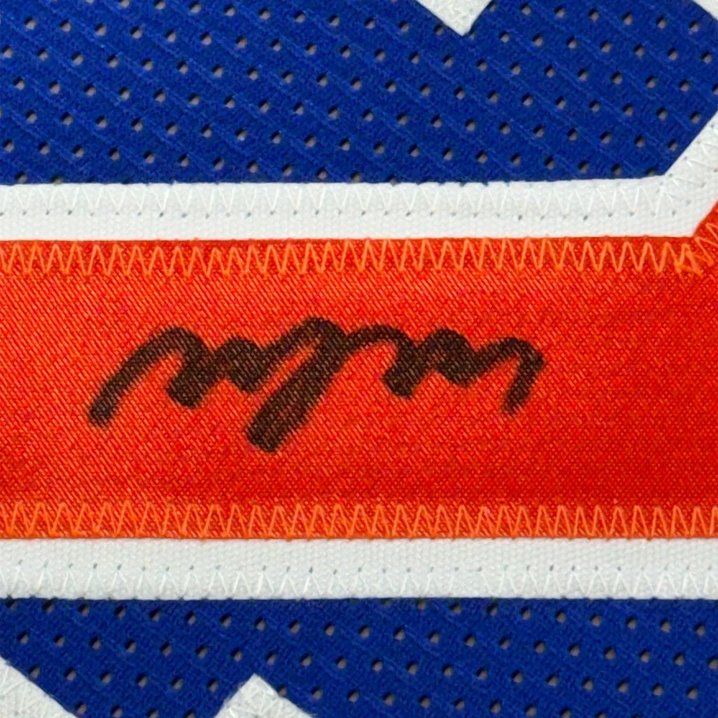 Framed autographed New York Knicks Miles McBride jersey with orange fabric and black signature