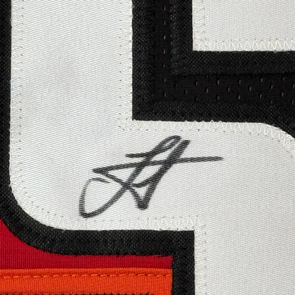 Autographed Nikola Jokic Denver Nuggets jersey with framed photos display