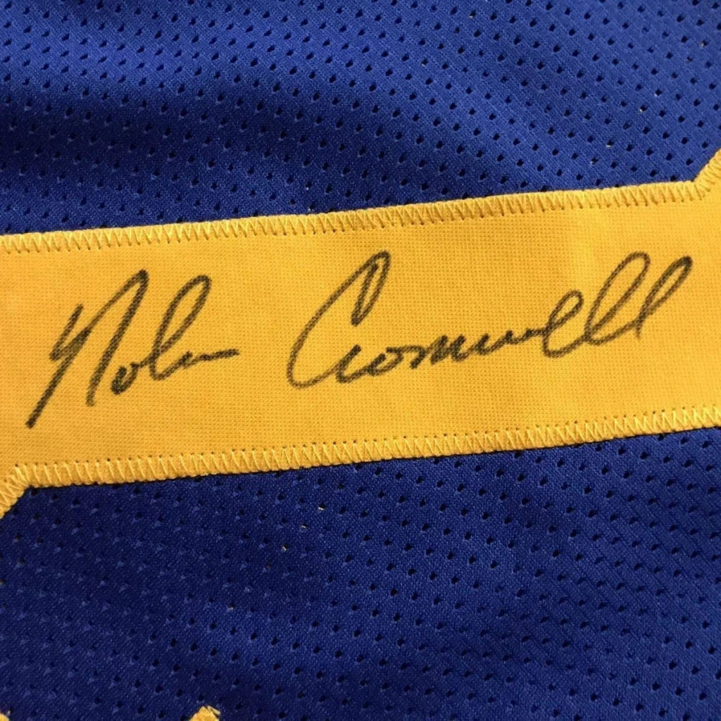 Framed autographed Nolan Cromwell LA Rams blue jersey with yellow stripe