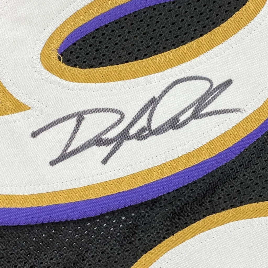 Autographed custom jersey with purple and gold trim from professional sports league