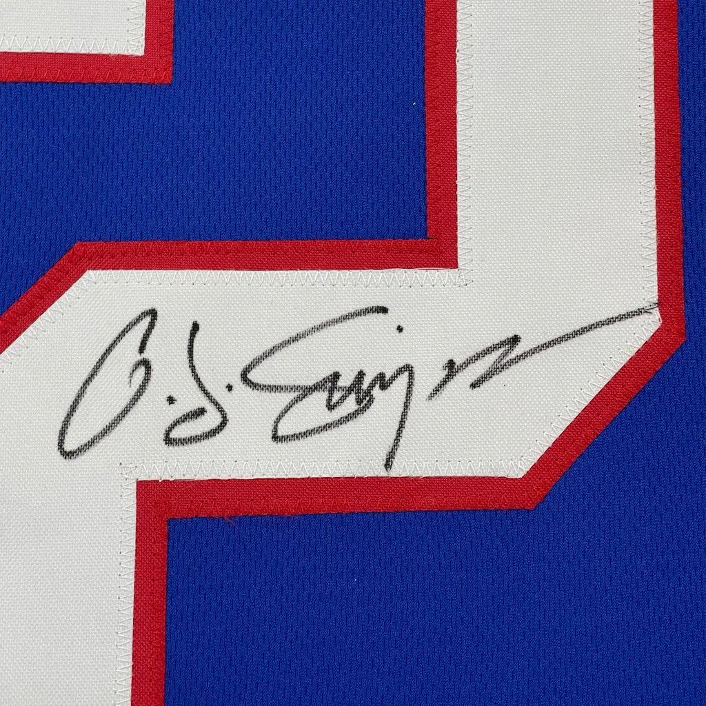 Blue sports jersey with black autograph, professionally framed with JSA COA authentication
