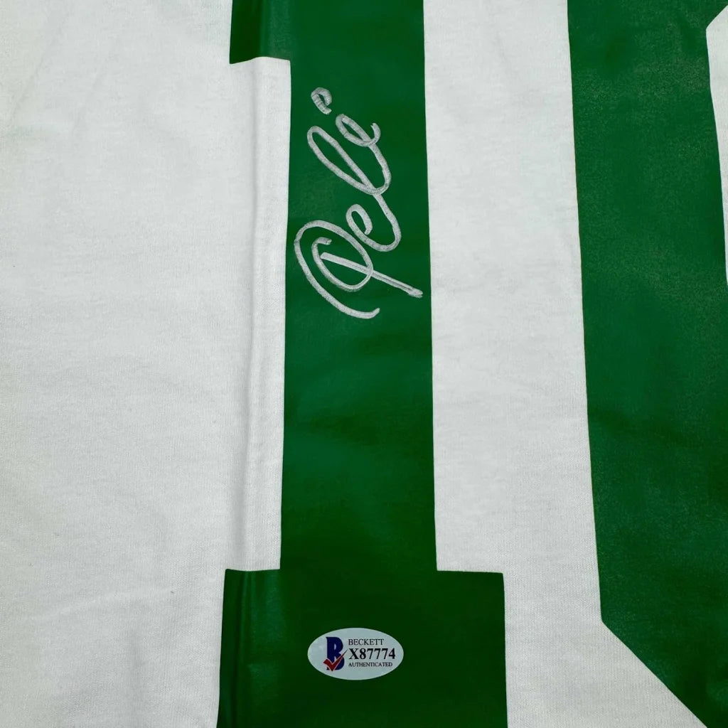 Framed autographed Pele New York Cosmos white jersey with green stripes and signature, Beckett BAS COA