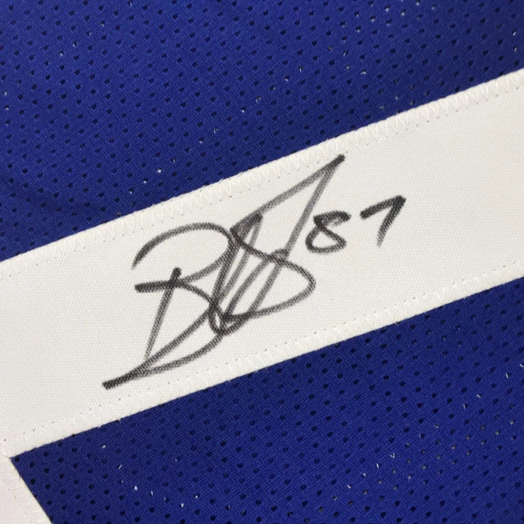 Blue and white mesh football jersey with black signature and number 87 on white stripe framed and autographed