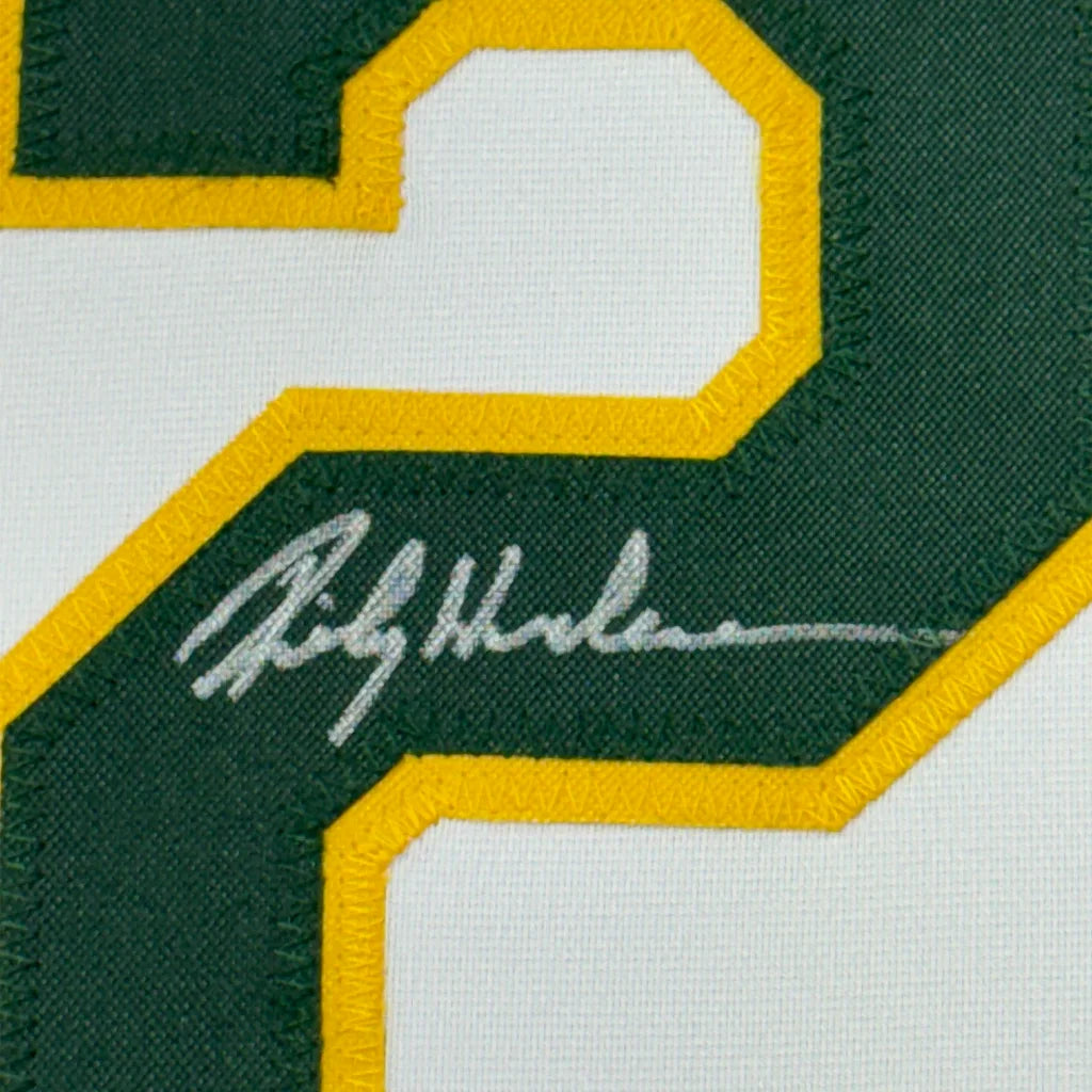 Framed autographed Rickey Henderson Oakland white baseball jersey with green yellow embroidered 2 and signature, Beckett BAS COA