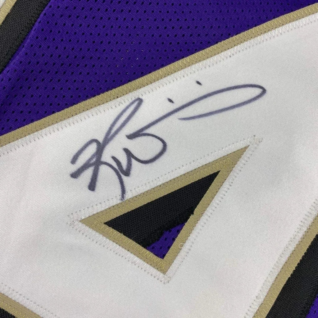Autographed purple and white Williams 34 Championship Ready Jersey for display