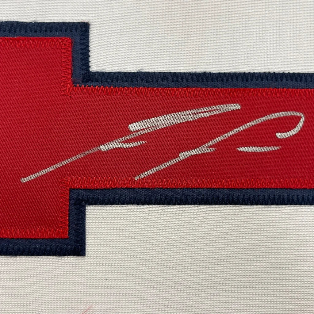 Red fabric patch with white autograph on Ronald Acuña Jr Signed Jersey Display