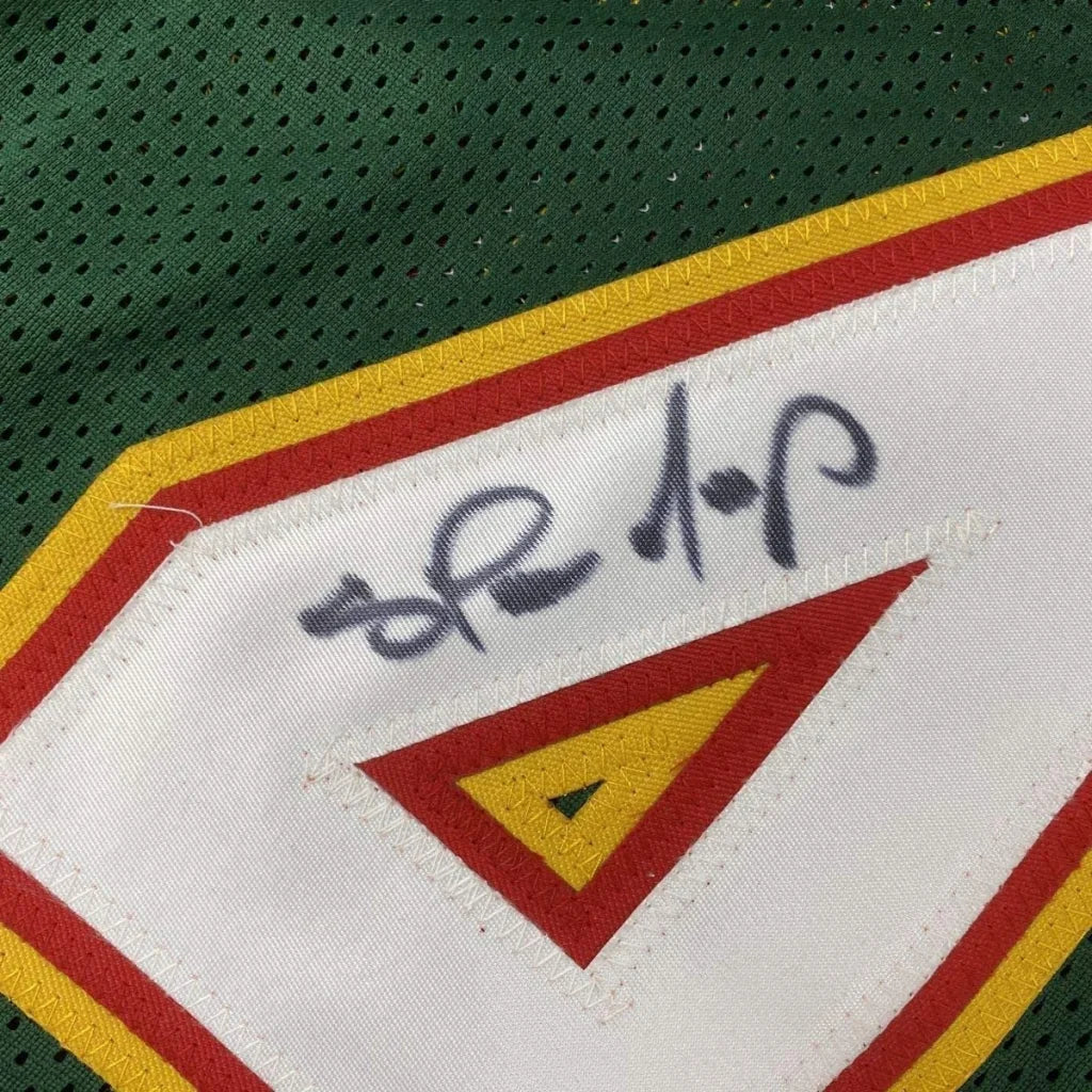 Autographed green and white Shawn Kemp Sonics jersey professionally framed with PSA DNA certification