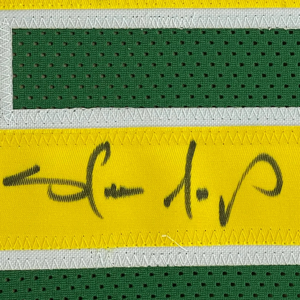 Green and yellow Shawn Kemp SuperSonics jersey with black autograph in a frame