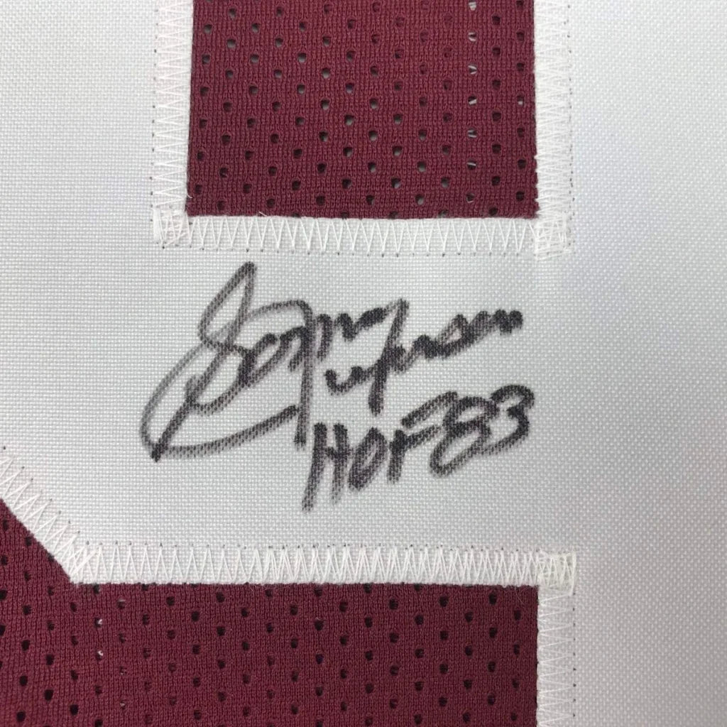 A maroon and white mesh washington football jersey signed by sonny jurgensen with jsa coa framed 35x39