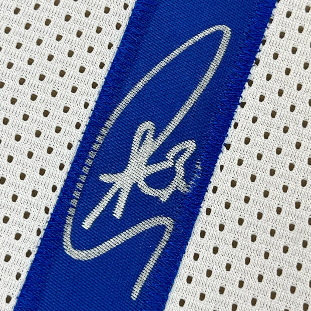 Framed autographed Stephen Curry Golden State white jersey with JSA COA