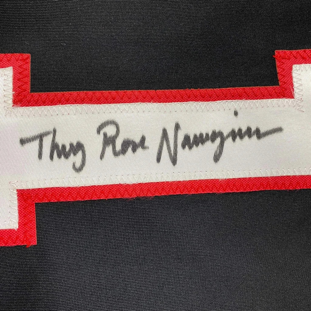 Black fabric with red-trimmed white strip and handwritten signature from Thug Rose Namajunas professionally framed jersey