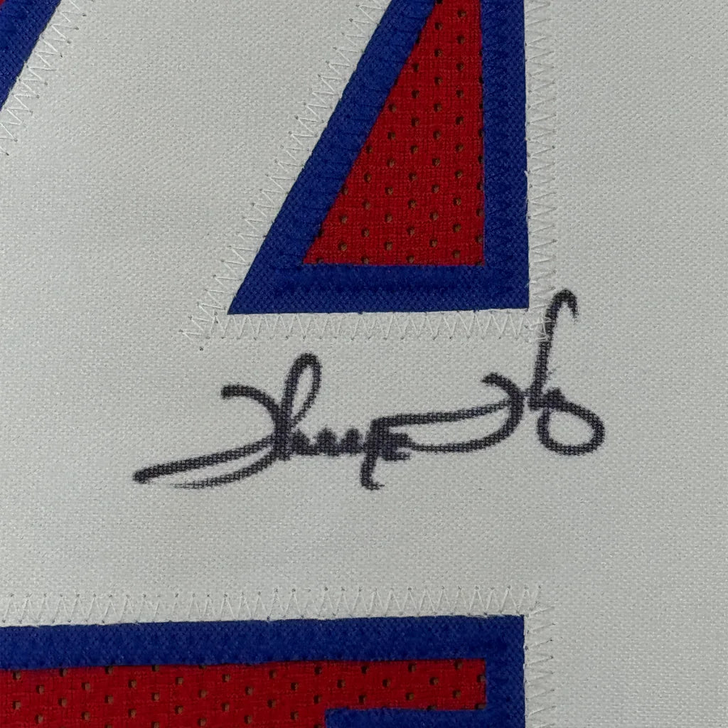 Framed autographed Thurman Thomas Buffalo red football jersey back with black signature