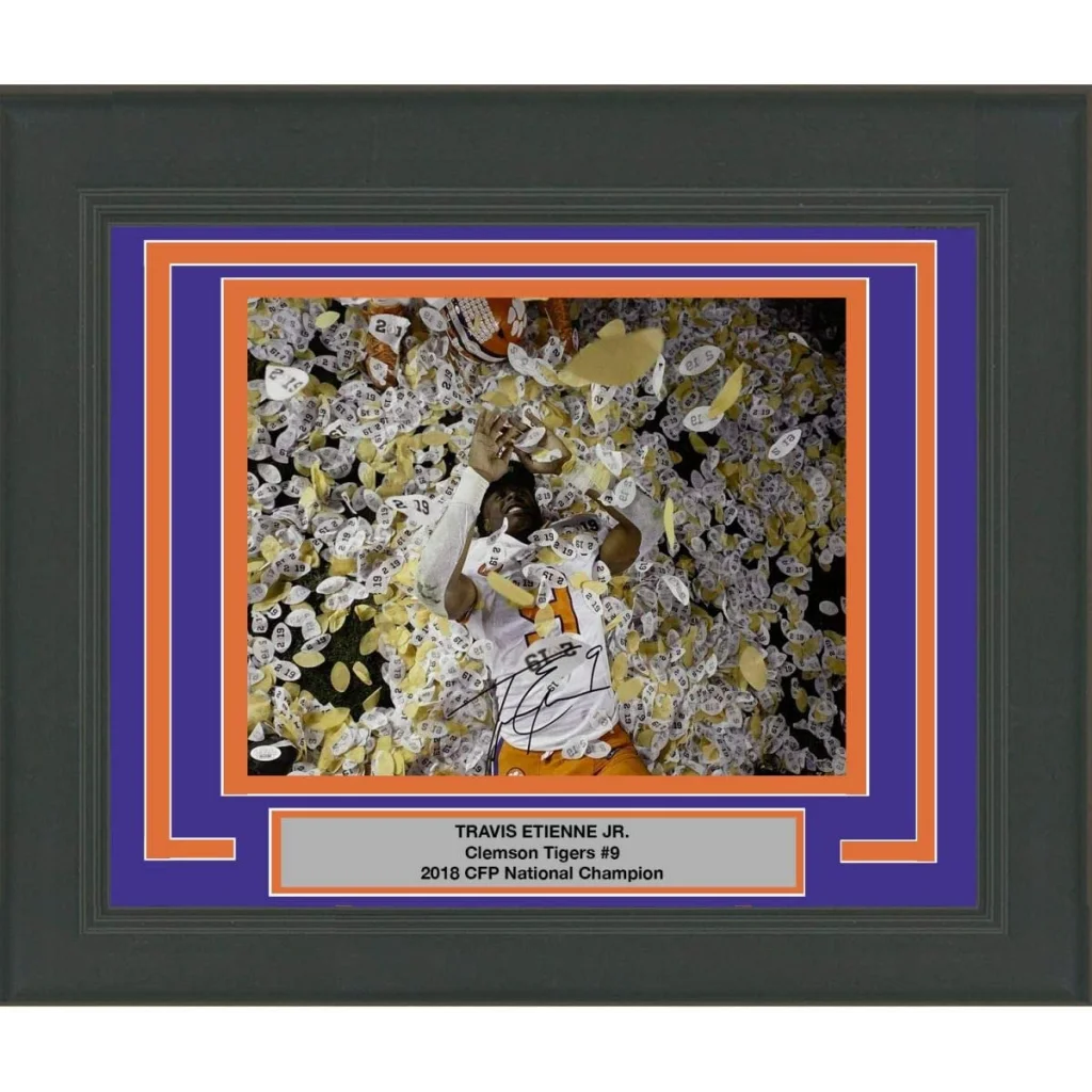 Framed photo of Travis Etienne Jr celebrating Clemson Tigers national championship