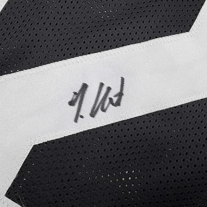 Framed autographed Travis Hunter black perforated mesh jersey Beckett COA