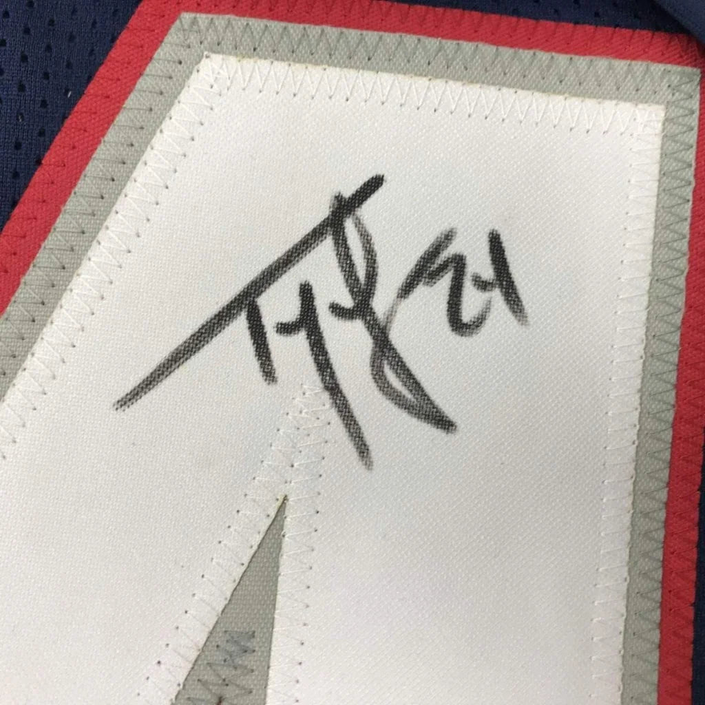 Framed autographed Ty Law New England Patriots jersey label with JSA COA