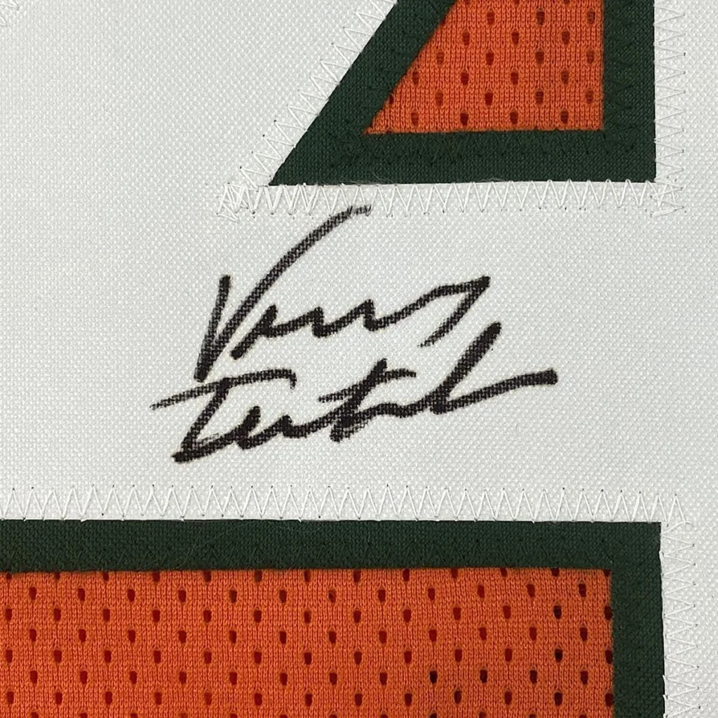 Autographed white and orange Miami Jersey framed with photos of Vinny Testaverde