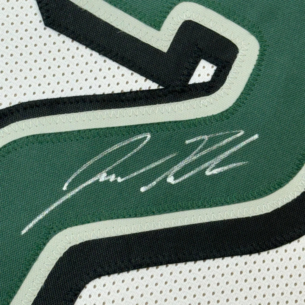 Autographed Jason Kelce Eagles jersey with photos in a frame for display