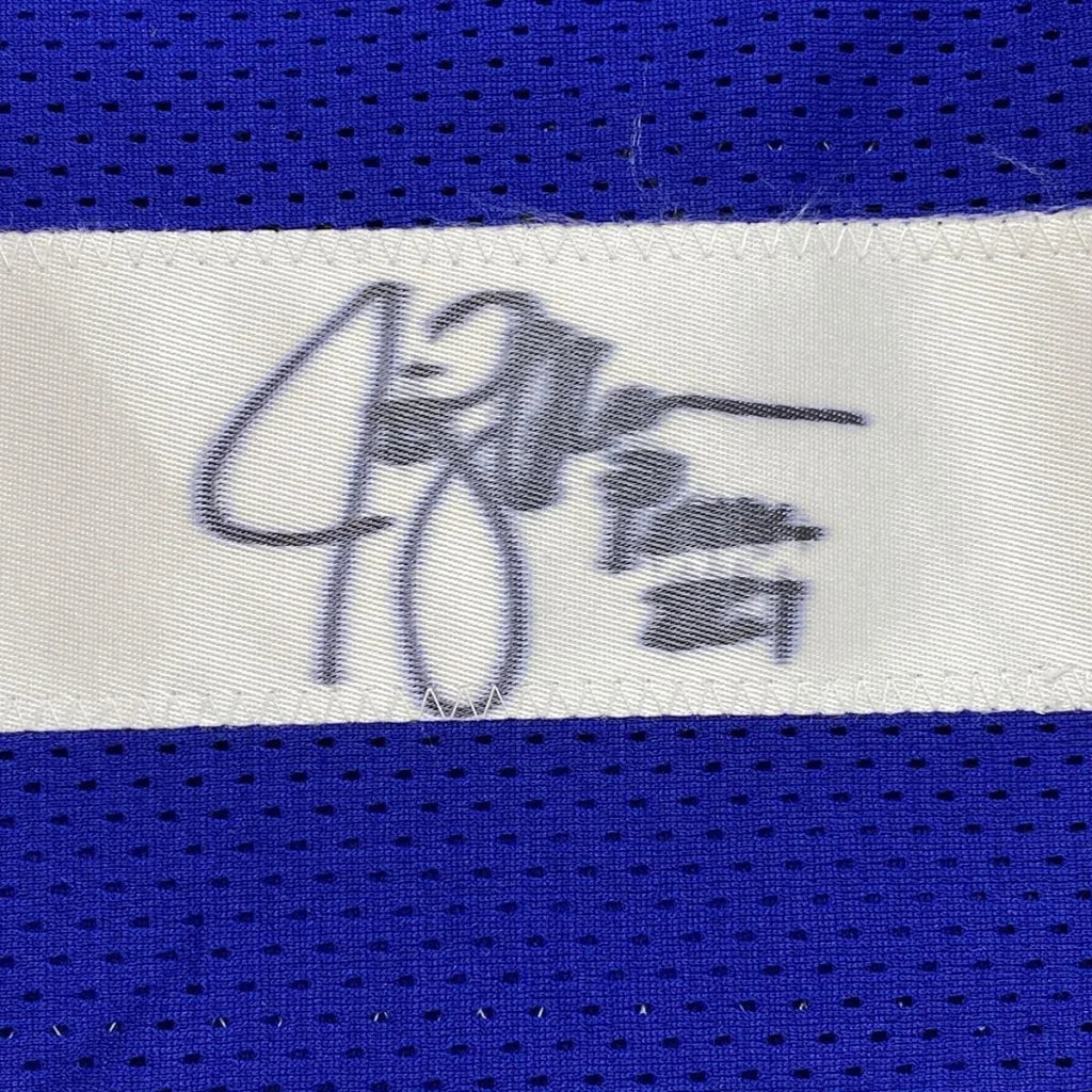 Blue Seahawks sports jersey with white tag and black Jim Zorn autograph for framing