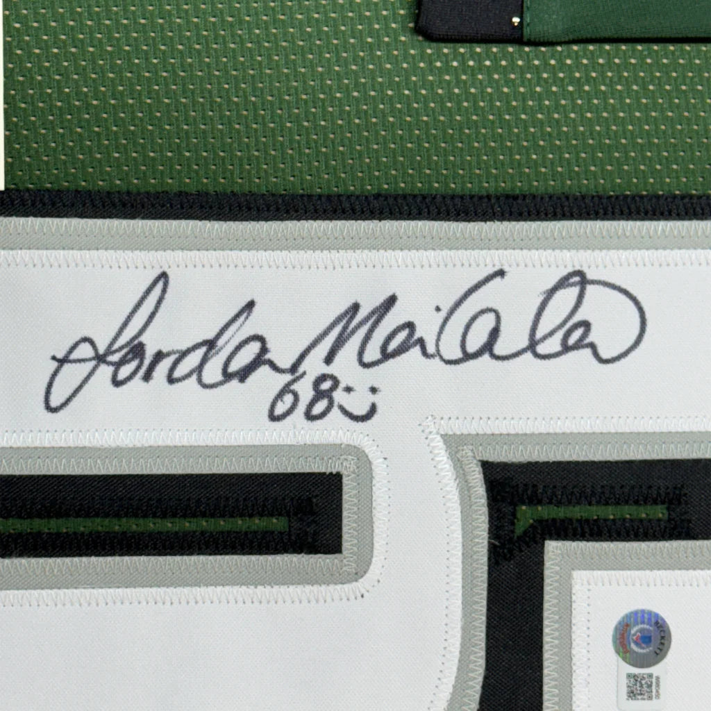 Autographed white Eagles Jersey framed with photos and Jordan Mailata signature