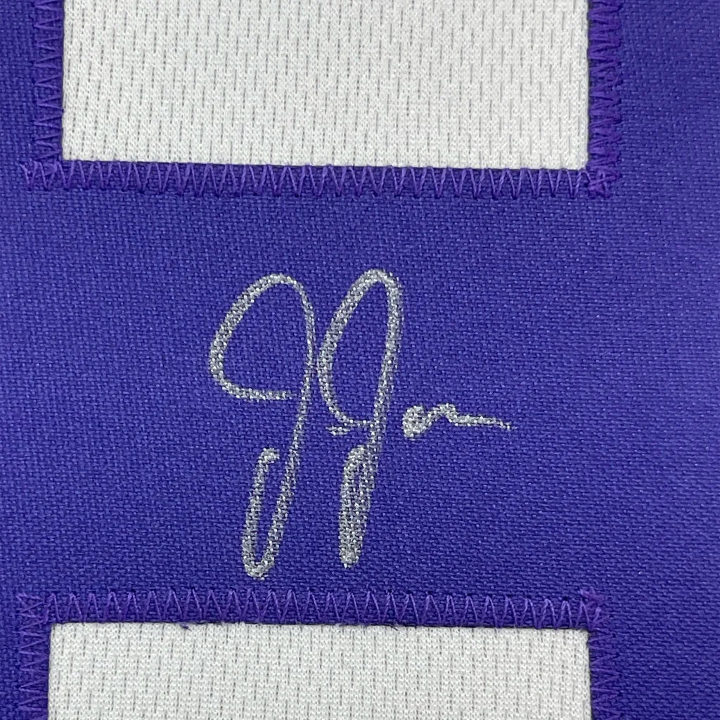 Purple Vikings jersey with a silver autograph in a framed Justin Jefferson display