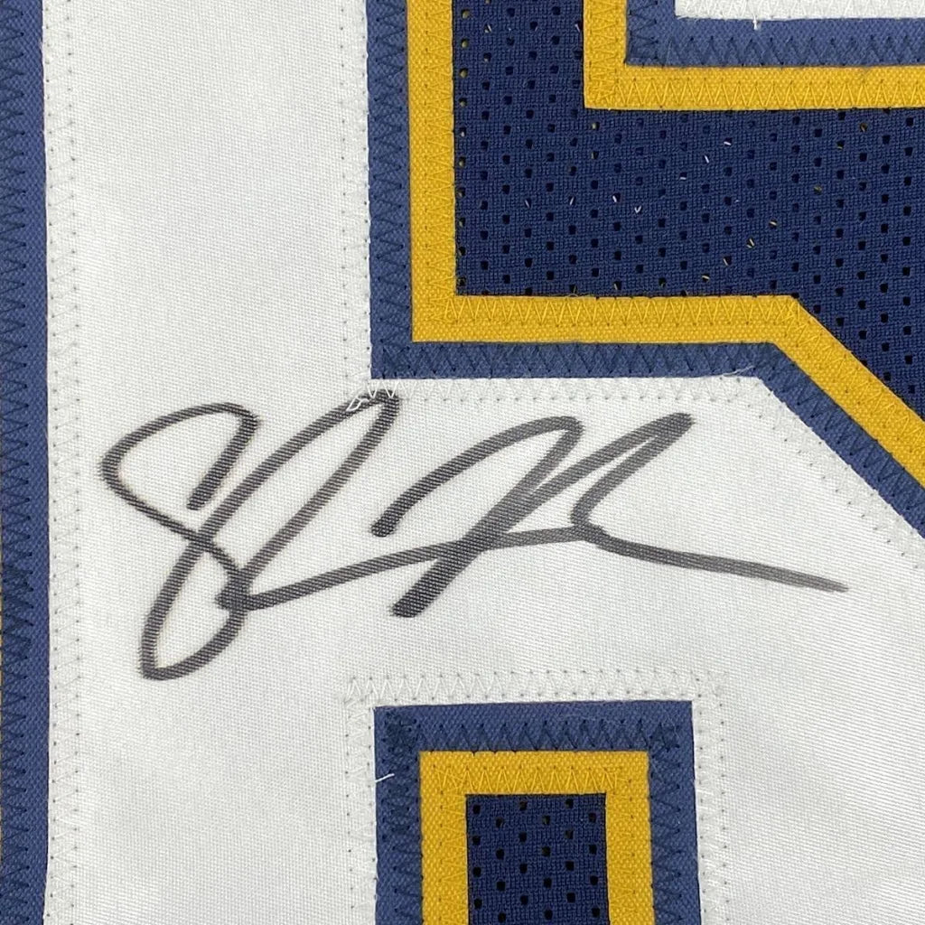 White Chargers jersey with blue and gold trim and LaDainian Tomlinson autograph