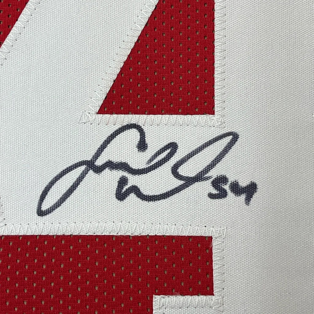 Red and white Fred Warner signed jersey in custom frame with photos