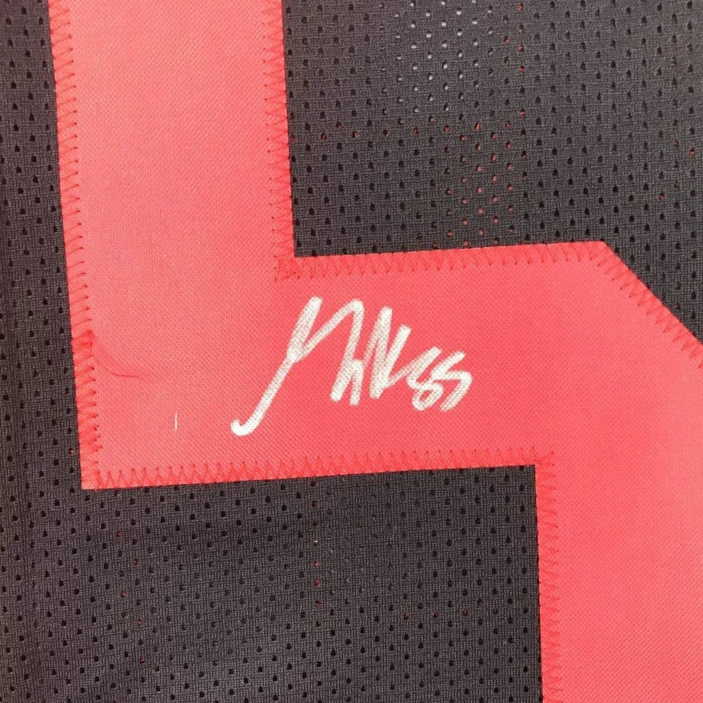 Black 49ers jersey with red number and white autograph from George Kittle