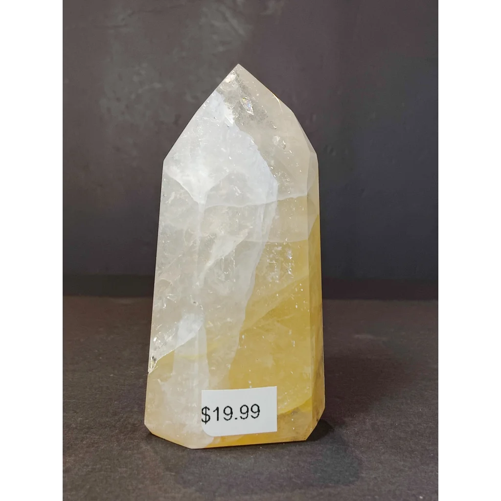 Golden healer polished obelisk tower sculpture featuring a translucent yellow and white fluorite crystal tower