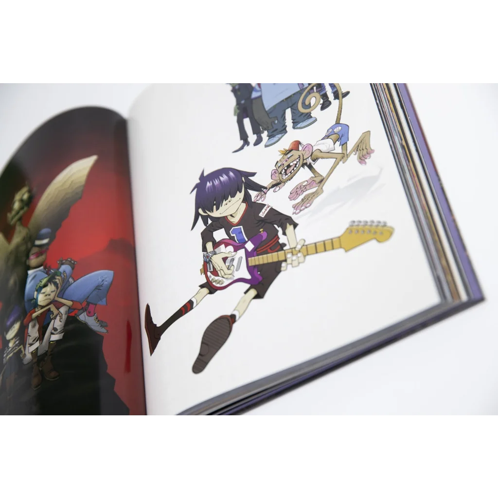 Open Gorillaz Almanac hardcover art book showing colorful Gorillaz character illustrations