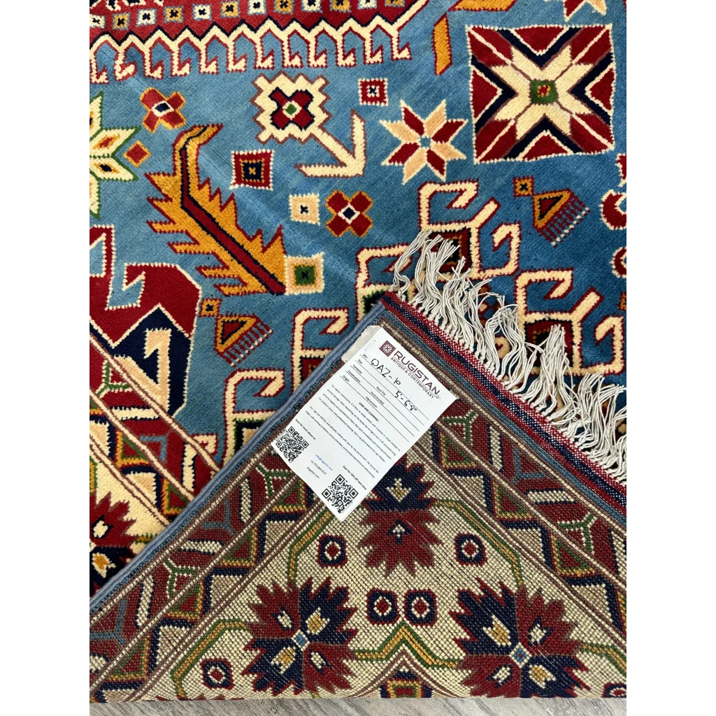 Vibrant blue hand-knotted Afghan Kazak rug with cotton foundation and intricate patterns