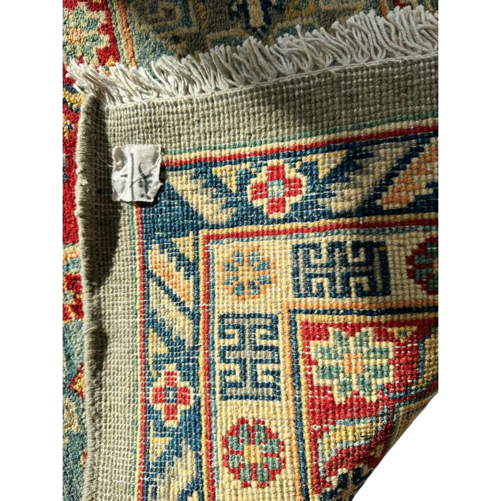 Hand-knotted Afghani Kazak wool rug with natural dyes, geometric patterns
