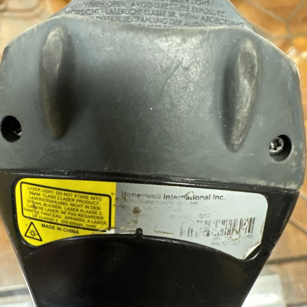 Black Honeywell barcode scanner laser pointer with matte finish and wear