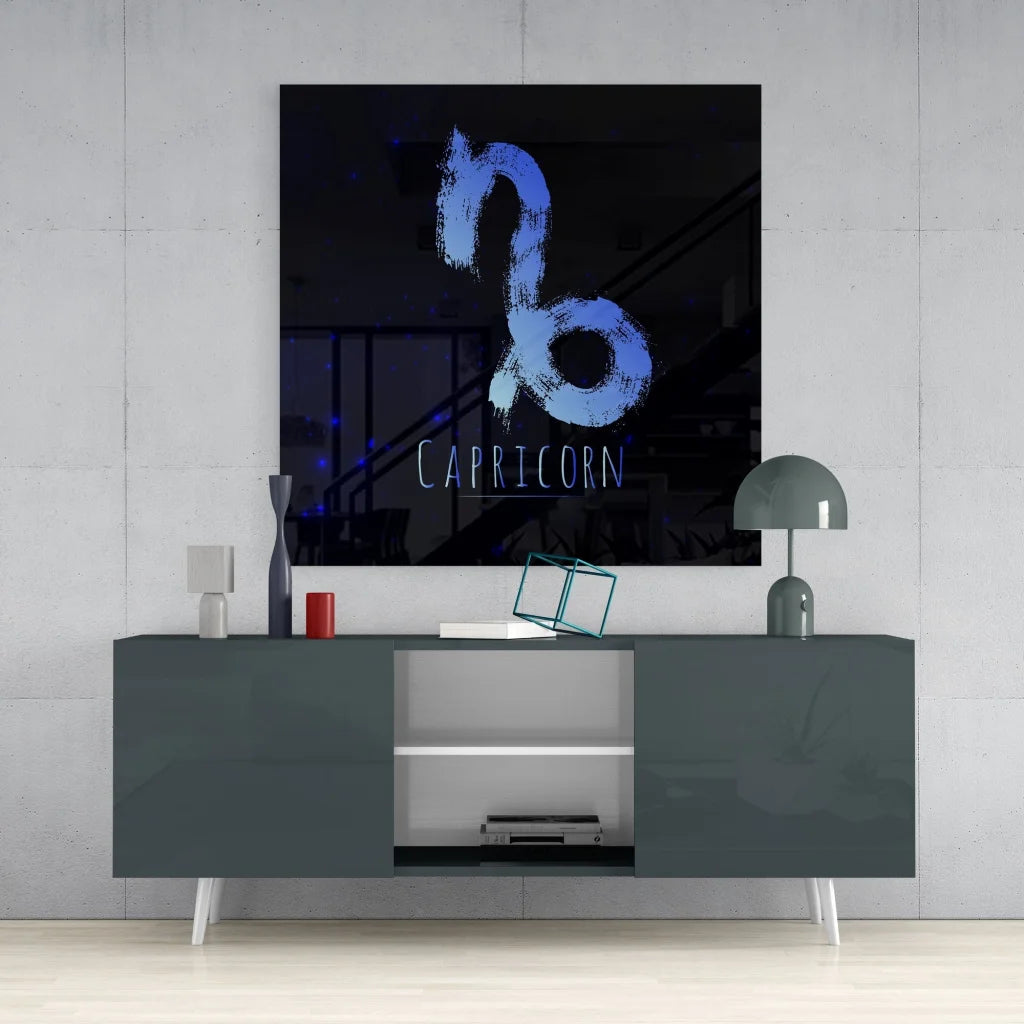 Capricorn zodiac tempered glass art with neon blue glow on gray console