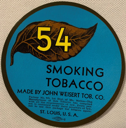 Circular blue tobacco label with brown leaf and yellow "54," made by John Weisert Tob. Co., St. Louis, on textured fabric bac