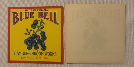 Vintage Blue Bell broom label with yellow background and red border showing blueberries on a branch, made by Hamburg Broom Wo