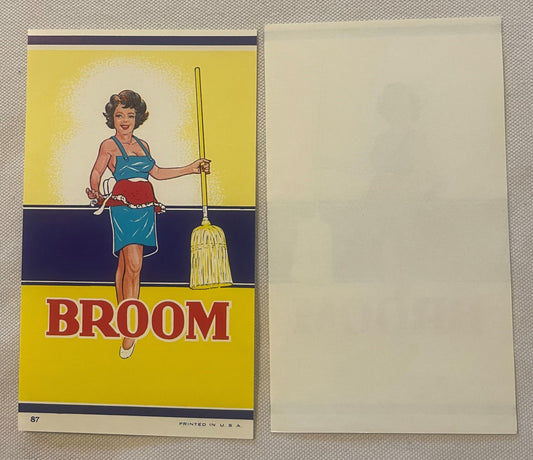 Vintage broom label featuring a smiling woman in blue halter top and red shorts holding a yellow broom, printed in yellow and